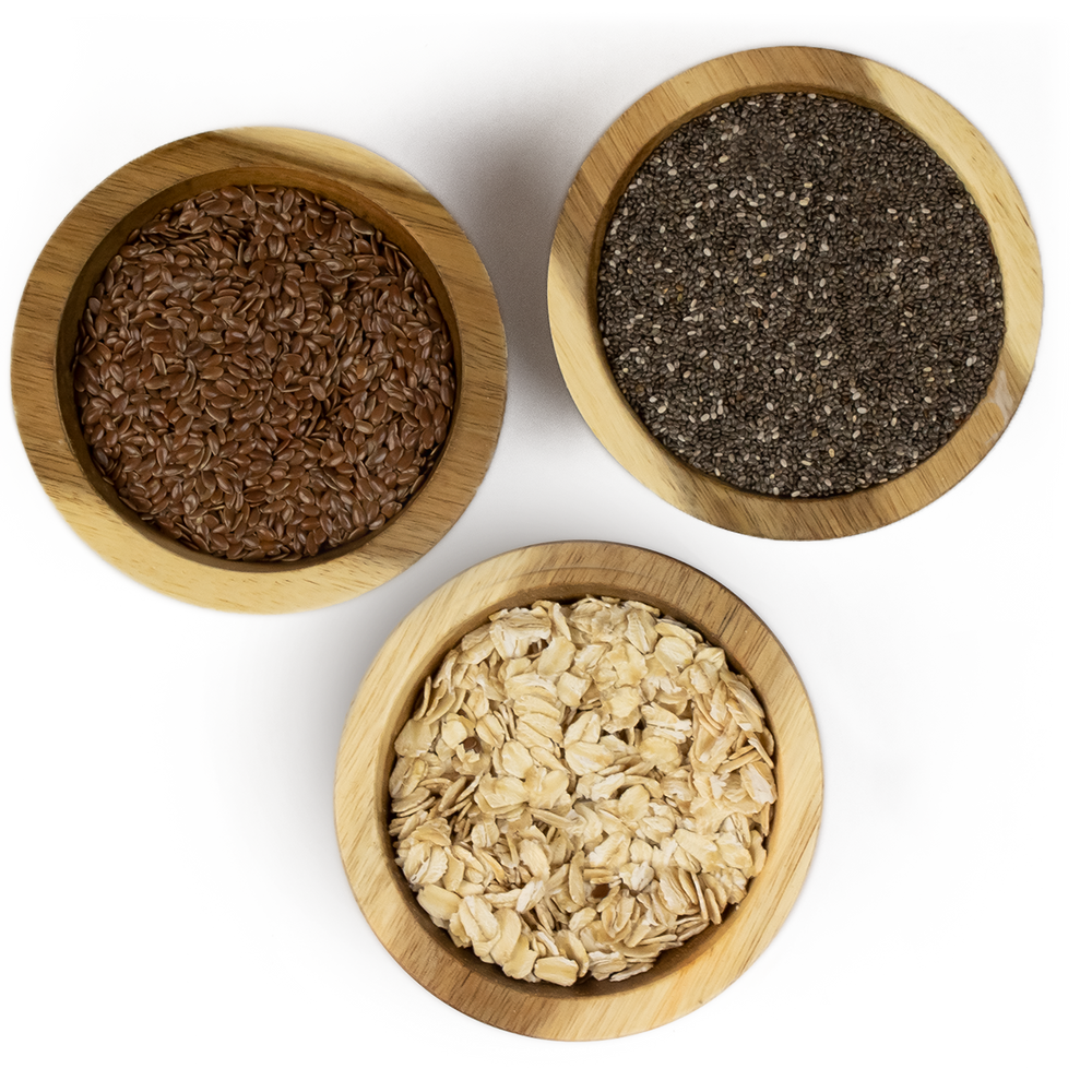 Flax seed, chia seed & oats in wooden bowls.