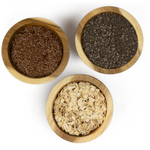 Flax seed, chia seed & oats in wooden bowls.